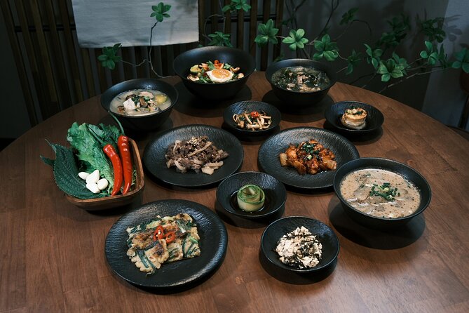Korean Cooking Class Full Meal with BBQ on an All in One Table - Plating bibimbap in your own style
