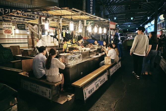 Seoul Night Palace & Market Food Tour with Vehicle - Walking through Seoul between historic stops